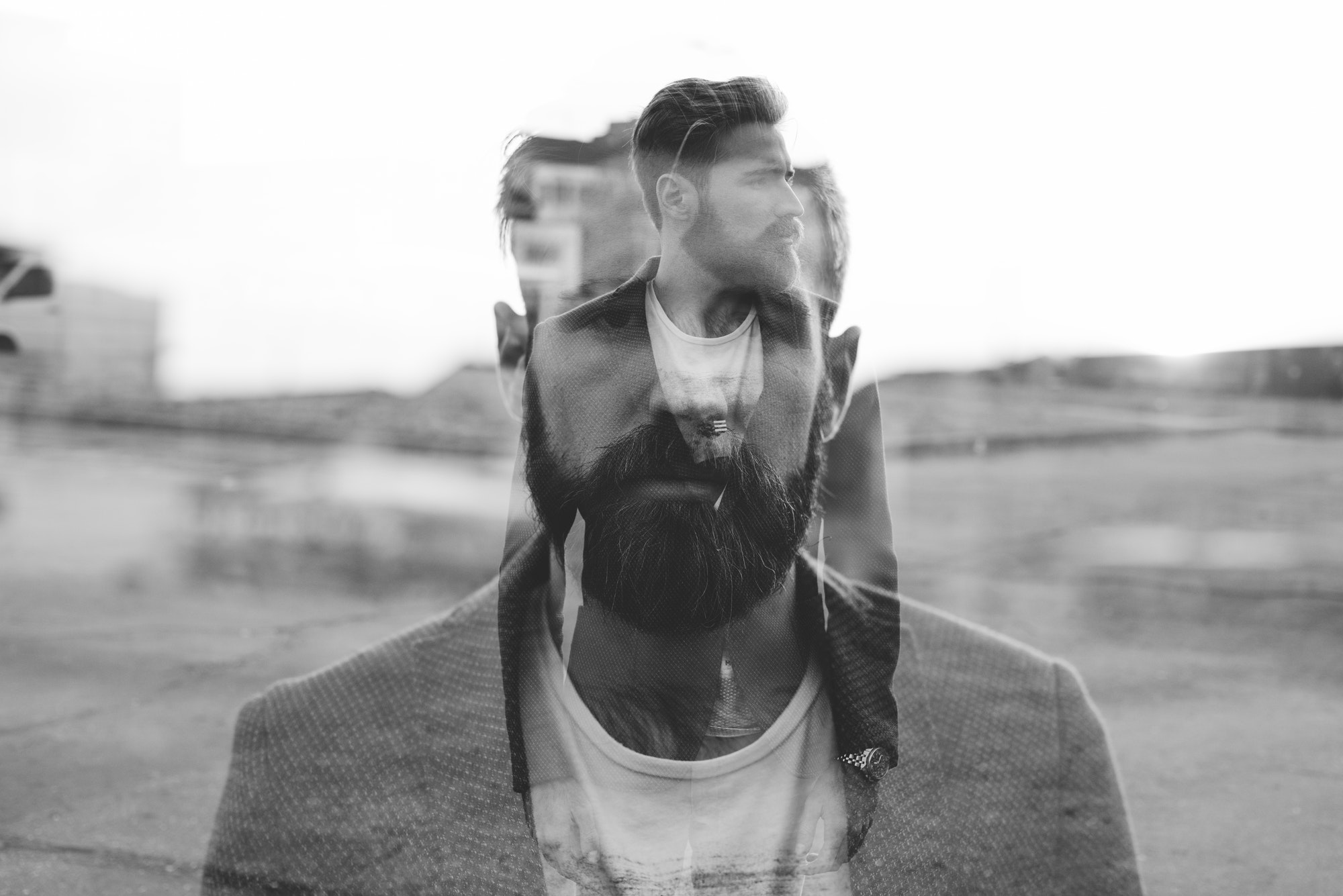 Double exposure young handsome bearded man