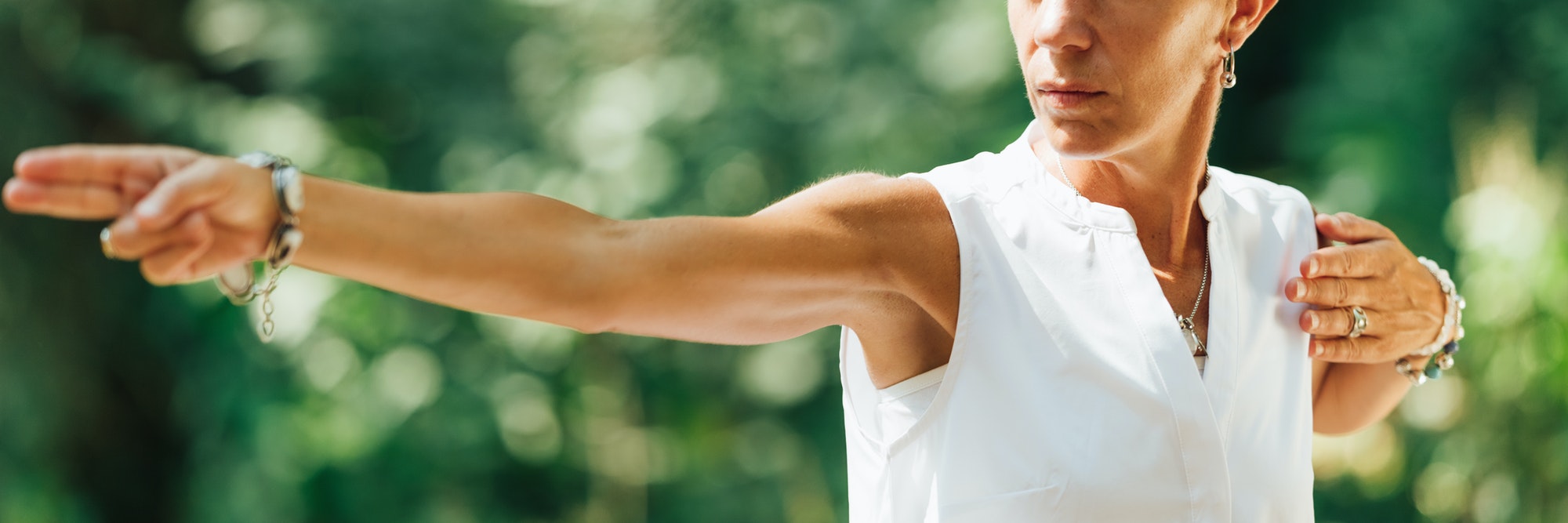 Qi Gong Female Expert Doing Qigong Exercises Outdoor for Moving "Chi" or Energy in the Body