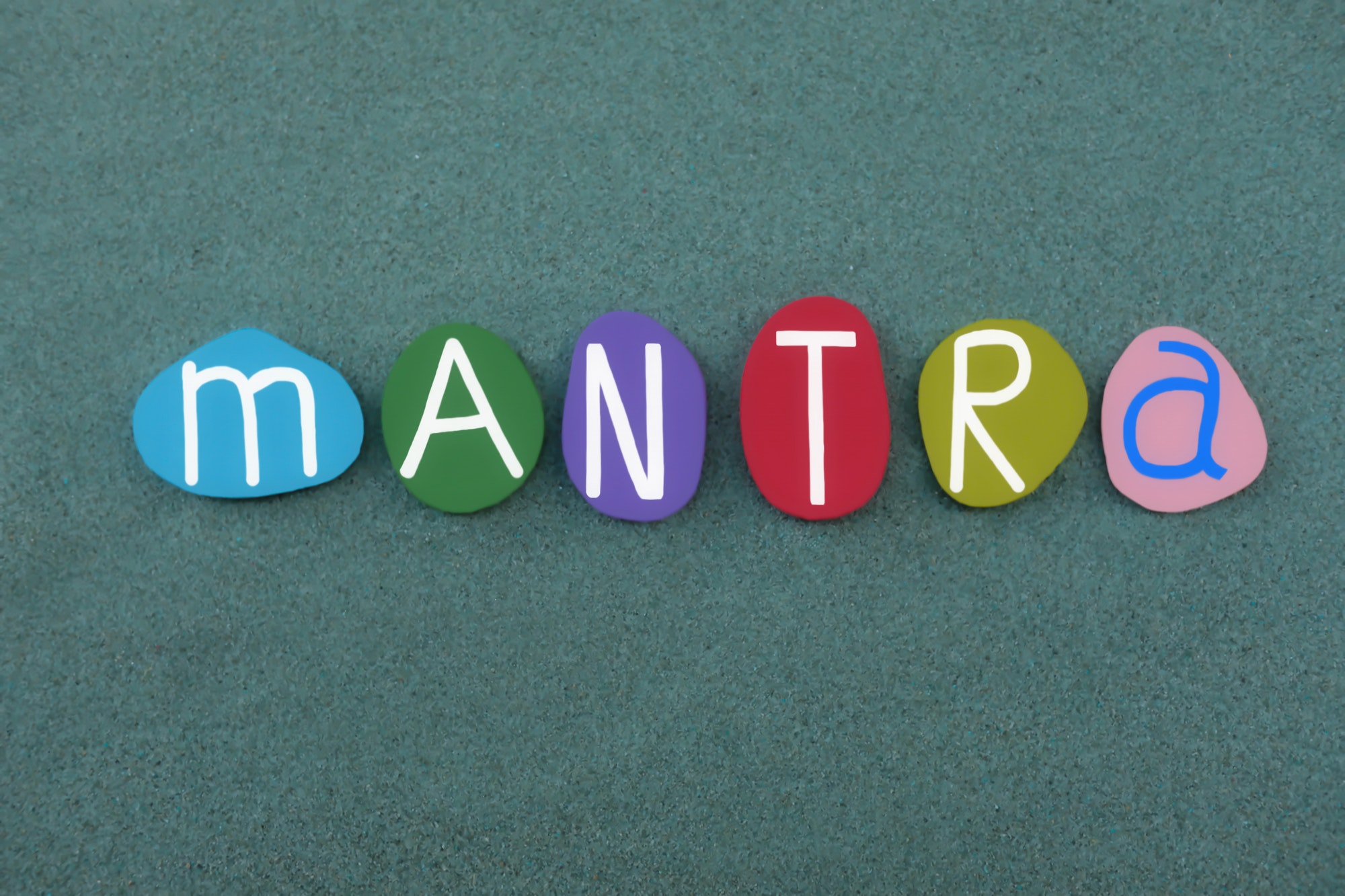 Mantra, motivating chant, usually any repeated word or phrase, text composed with colored letters